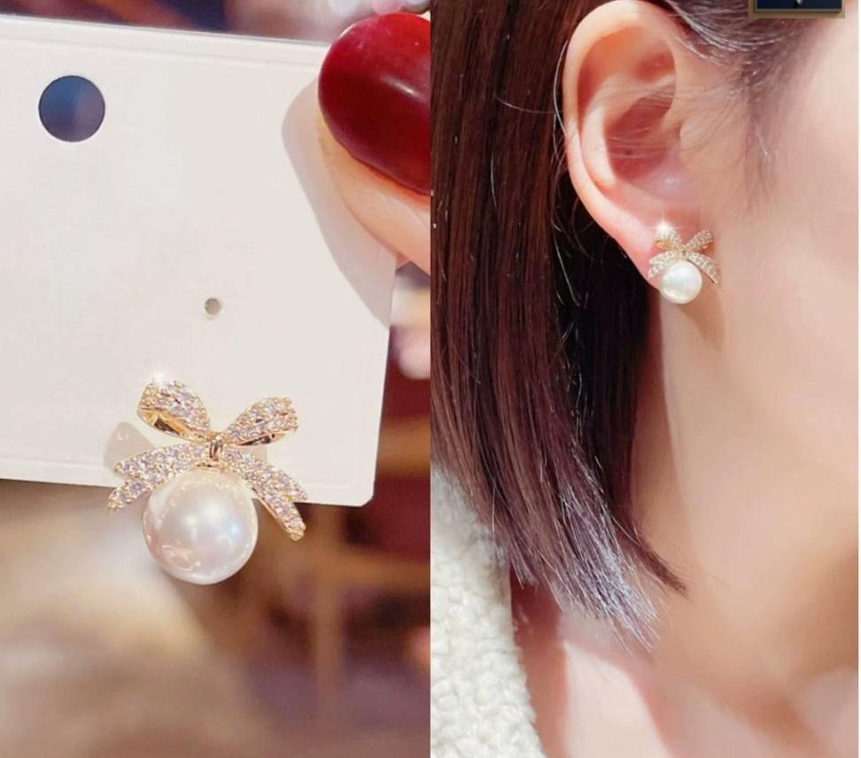 Korean Crystal Bow Pearl Drop Earrings on ear