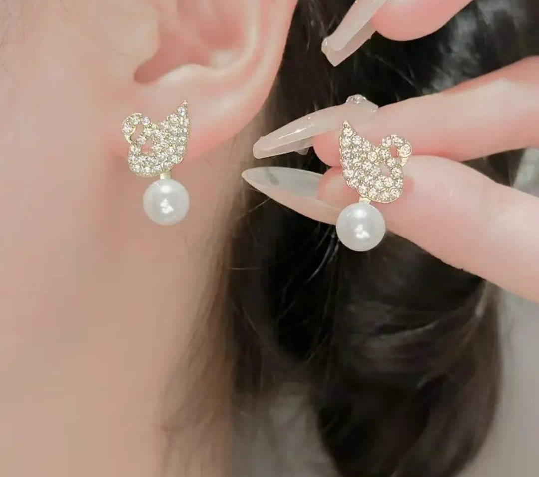 Korean Swan Pearl Stud Earrings on ear